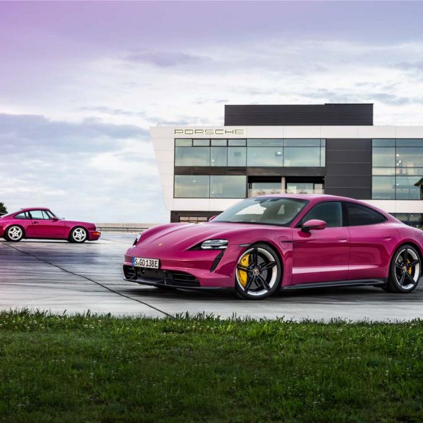 Porsche Taycan and 964 911 in front of Porsche Factory
