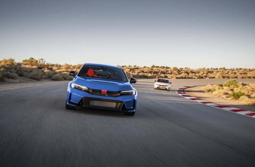 Boost Blue 2023 Honda Civic Type R on track with a Championship White 2023 Honda Civic Type R